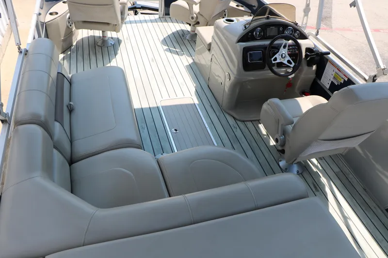 Slide: The Image of Interior of 2017 Trifecta 21 F Sts pontoon boat with beige seating and steering console. - 28