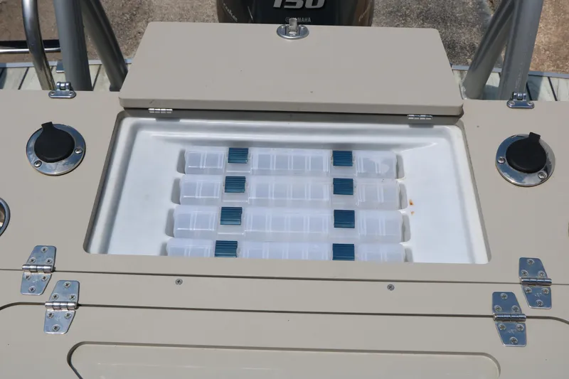 Slide: The Image of Storage compartment on a 2017 Trifecta 21 F Sts boat, featuring organized containers. - 31