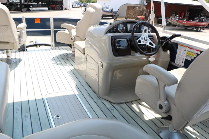Slide: The Image of Interior of a 2017 Trifecta 21 F Sts pontoon boat with steering console and seating. - 32