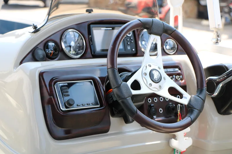 Slide: The Image of Steering console of 2017 Trifecta 21 F Sts boat with gauges and controls. - 34