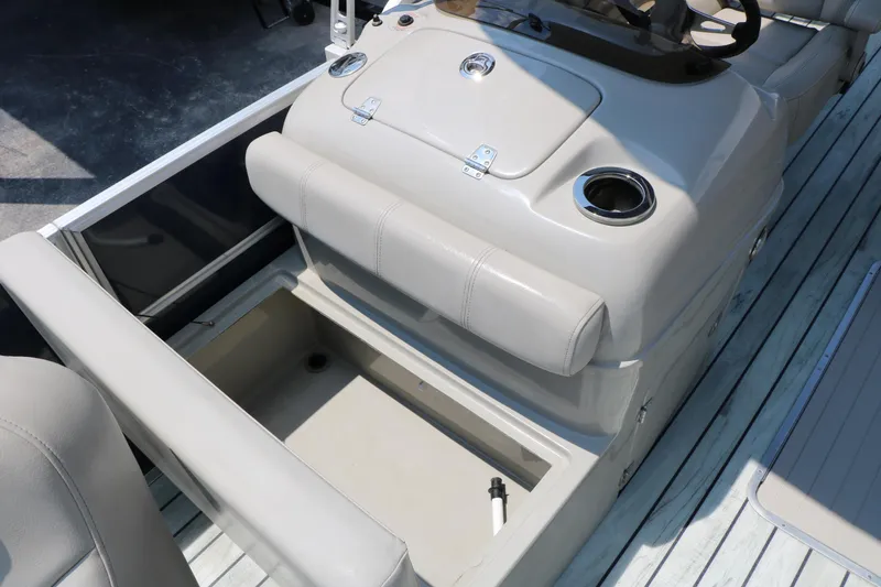 Slide: The Image of 2017 Trifecta 21 F Sts boat interior with storage compartment and cup holder. - 36