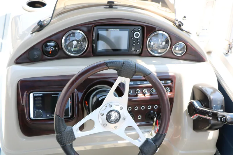 Slide: The Image of Steering console of a 2017 Trifecta 21 F Sts boat with gauges and controls. - 37