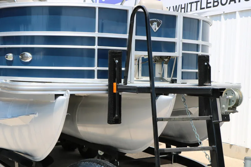 Slide: The Image of 2017 Trifecta 21 F Sts pontoon boat on trailer, featuring blue and silver design. - 6