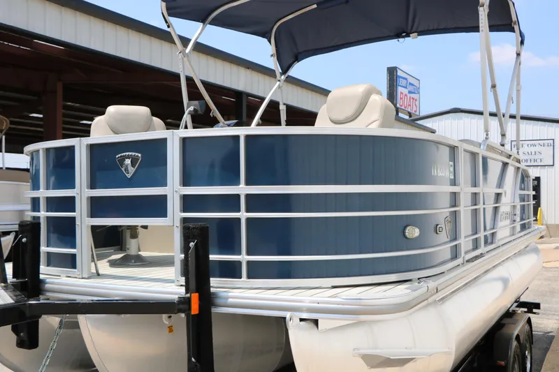 Slide: The Image of 2017 Trifecta 21 F Sts pontoon boat with blue exterior on a trailer. - 9