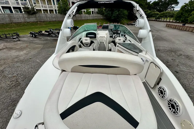 Slide: The Image of 2011 Chaparral 267 SSX boat interior with seating and dashboard view. - 10