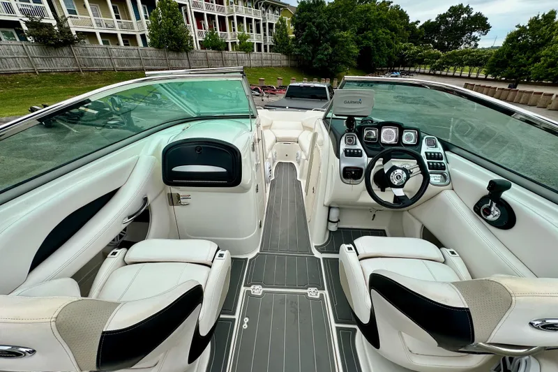 Slide: The Image of 2011 Chaparral 267 SSX boat interior with modern dashboard and seating. - 5