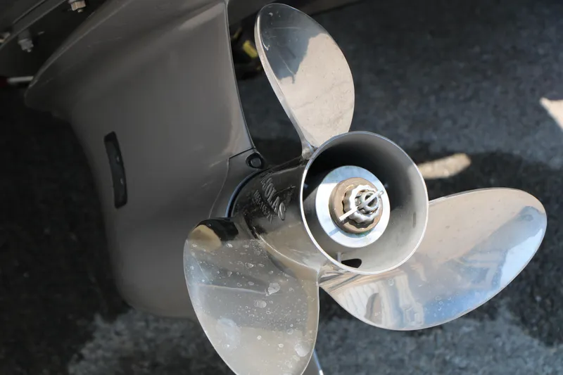 Slide: The Image of Close-up of a 2015 Glastron 205 GTS boat propeller on a textured surface. - 14