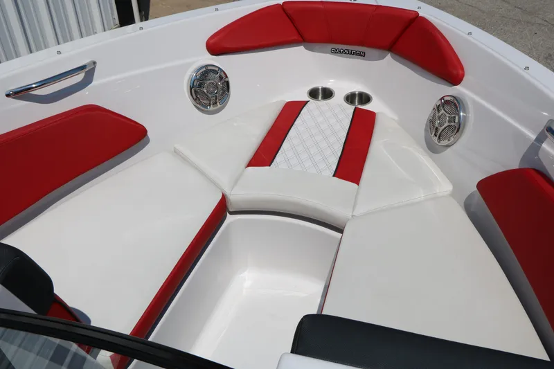 Slide: The Image of 2015 Glastron 205 GTS boat interior with red and white seating and cup holders. - 19