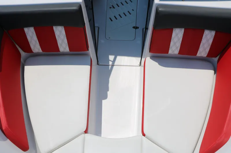 Slide: The Image of Interior seating of 2015 Glastron 205 GTS boat with red and white upholstery. - 22