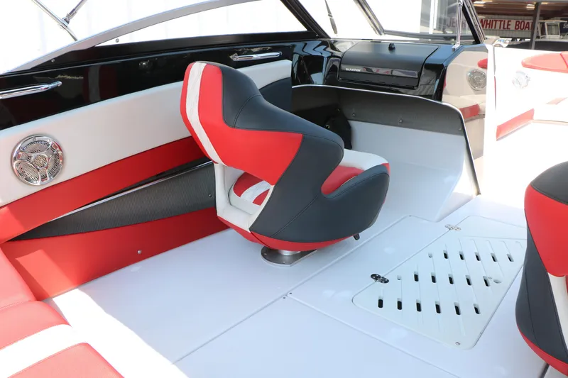 Slide: The Image of 2015 Glastron 205 GTS boat interior with red and white seating and modern dashboard. - 26