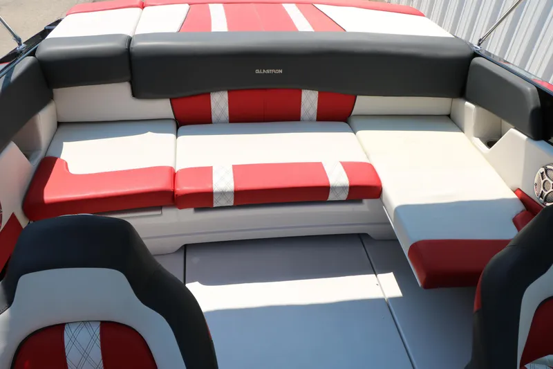 Slide: The Image of 2015 Glastron 205 GTS boat interior with red and white seating. - 27