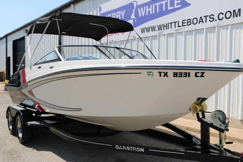 Slide: The Image of 2015 Glastron 205 GTS boat on trailer outside dealership. - 6