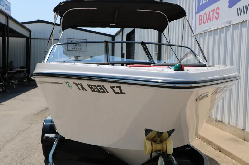 Slide: The Image of 2015 Glastron 205 GTS boat on trailer, parked outside sales office. - 7