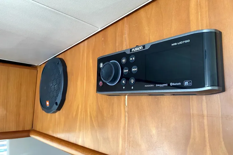 Slide: The Image of Fusion MS-UD750 stereo system and JBL speaker on 2005 Mainship 34 Trawler. - 21