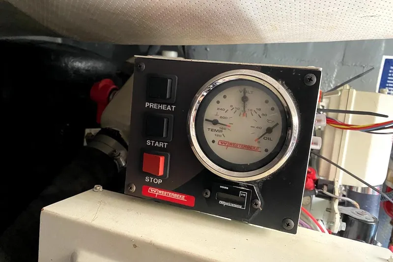 Slide: The Image of Control panel of a 2005 Mainship 34 Trawler with gauges and buttons. - 51