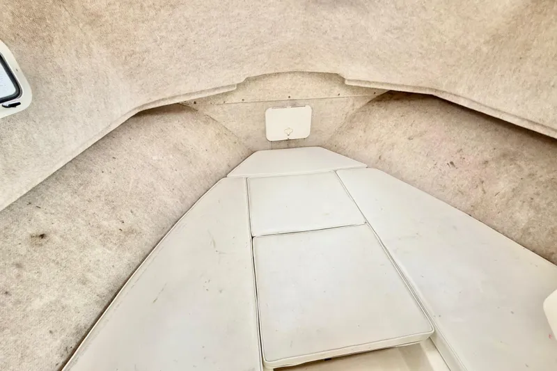 Slide: The Image of Interior cabin of 2008 Parker 2520XLD boat with cushioned seating. - 14