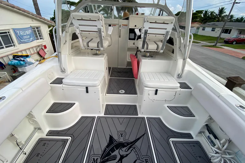 Slide: The Image of 2004 Hydra-Sports Vector 2800 WA boat interior with seating and deck details. - 13