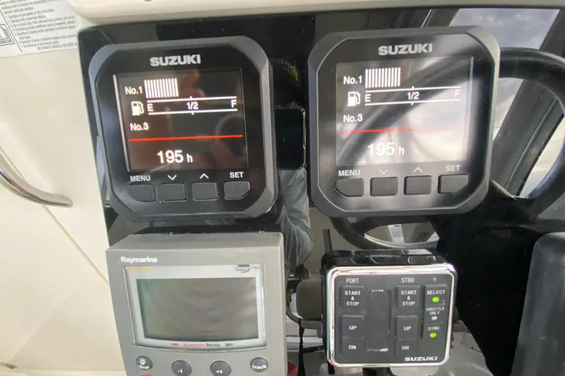 Slide: The Image of Dashboard of a 2004 Hydra-Sports Vector 2800 WA with Suzuki engine displays. - 16