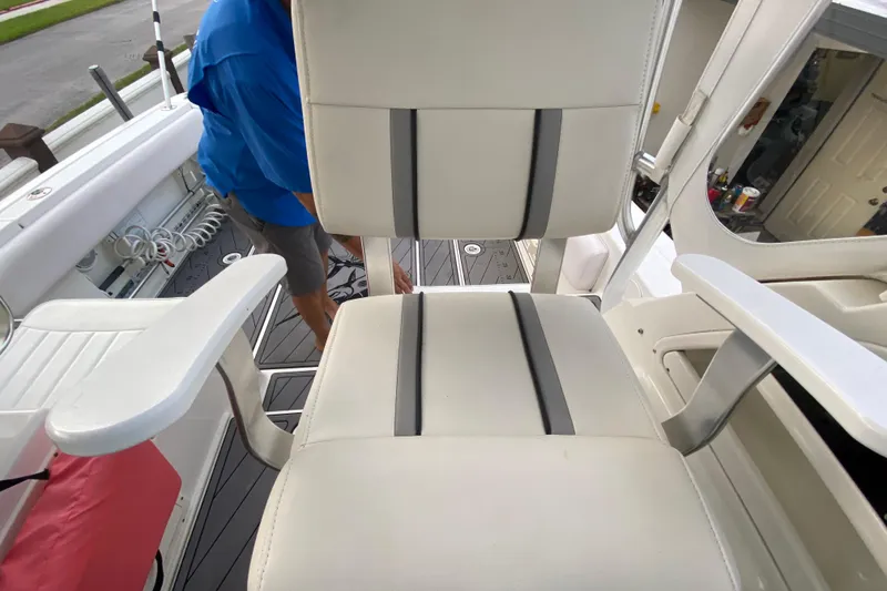 Slide: The Image of 2004 Hydra-Sports Vector 2800 WA boat interior with white seating and deck view. - 21