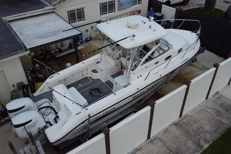 Slide: The Image of 2004 Hydra-Sports Vector 2800 WA boat docked in residential area, aerial view. - 24