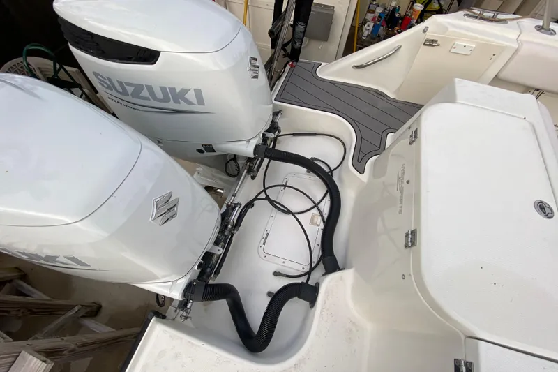 Slide: The Image of 2004 Hydra-Sports Vector 2800 WA with dual Suzuki outboard motors, detailed view. - 26