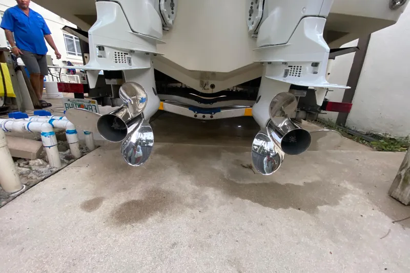 Slide: The Image of 2004 Hydra-Sports Vector 2800 WA boat with dual outboard motors and shiny propellers. - 29