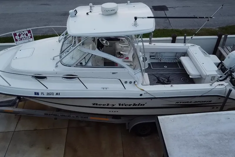 Slide: The Image of 2004 Hydra-Sports Vector 2800 WA boat for sale, white exterior, on trailer. - 4
