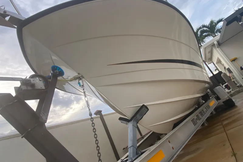 Slide: The Image of 2004 Hydra-Sports Vector 2800 WA boat on trailer, viewed from below, showcasing hull design. - 9