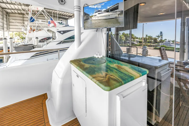 Slide: The Image of Luxurious Neptunus 65 Flybridge yacht interior with elegant countertop and modern amenities, year 2000 model. - 21