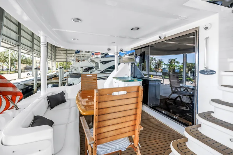 Slide: The Image of Luxurious 2000 Neptunus 65 Flybridge yacht interior with elegant seating and wooden accents. - 22