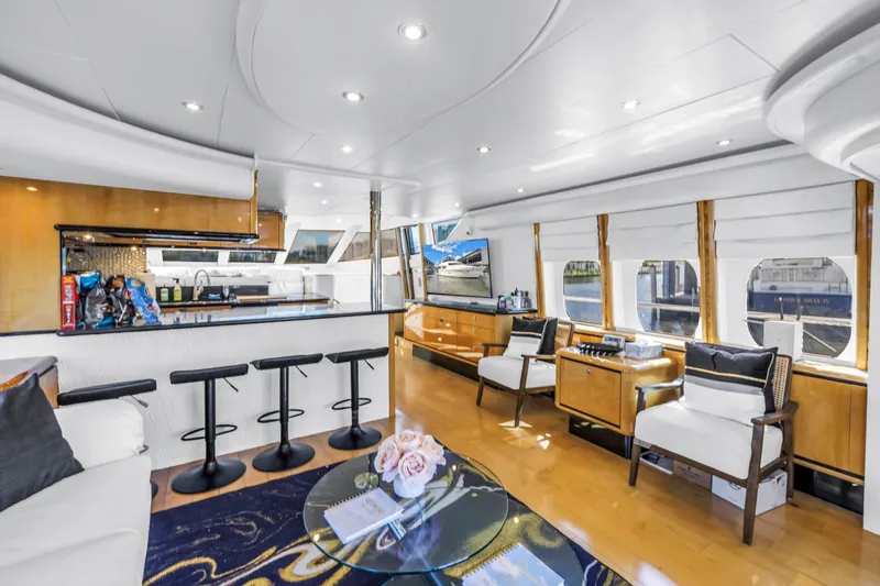 Slide: The Image of Luxurious interior of 2000 Neptunus 65 Flybridge yacht with modern seating and elegant decor. - 26