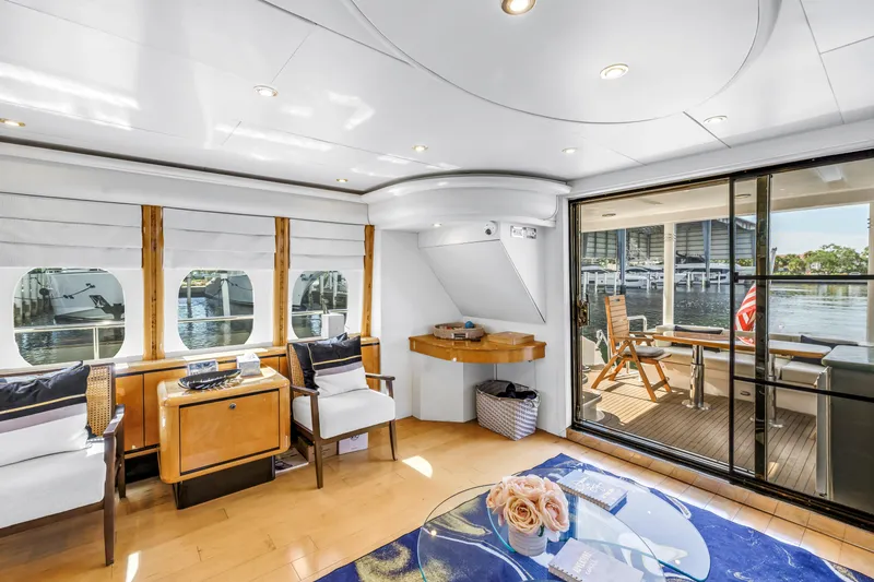 Slide: The Image of Luxurious interior of 2000 Neptunus 65 Flybridge yacht with elegant seating and waterfront view. - 29