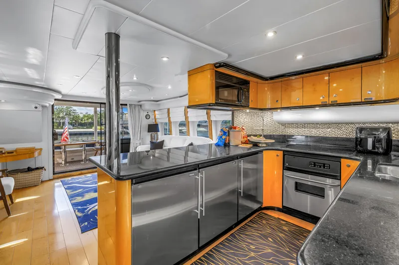 Slide: The Image of Luxurious interior of 2000 Neptunus 65 Flybridge yacht with modern kitchen and elegant design. - 31