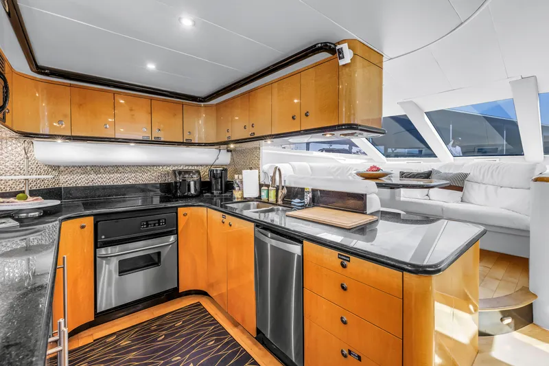 Slide: The Image of Luxurious kitchen interior of 2000 Neptunus 65 Flybridge yacht with modern amenities. - 32