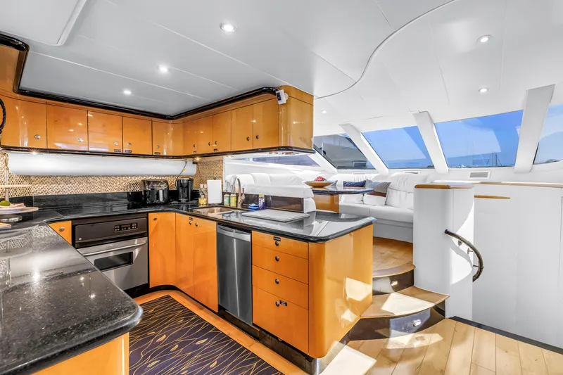 Slide: The Image of Luxurious interior of 2000 Neptunus 65 Flybridge yacht with modern kitchen and seating area. - 35