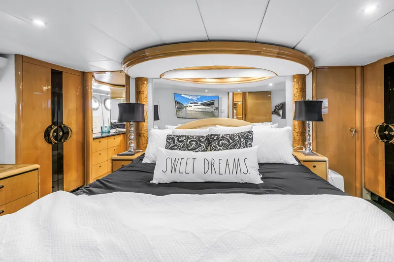 Slide: The Image of Luxurious bedroom interior of 2000 Neptunus 65 Flybridge yacht with elegant decor and cozy bedding. - 38