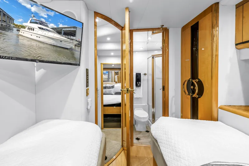 Slide: The Image of Luxurious Neptunus 65 Flybridge 2000 yacht interior with twin beds and modern amenities. - 46