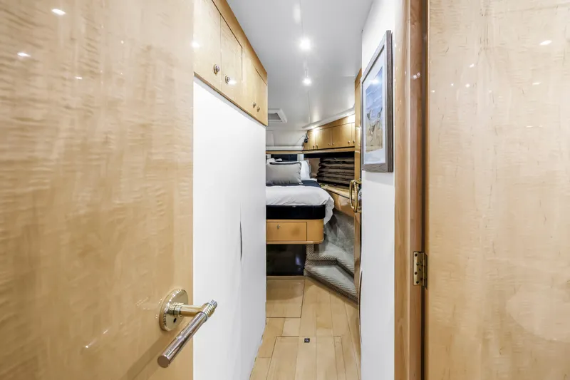 Slide: The Image of Luxurious cabin interior of 2000 Neptunus 65 Flybridge yacht, featuring elegant wood finishes. - 49