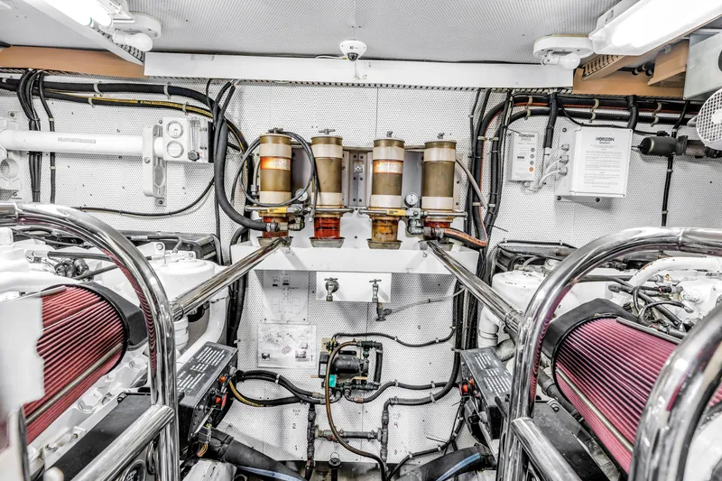 Slide: The Image of Engine room of 2000 Neptunus 65 Flybridge yacht with detailed mechanical components. - 59