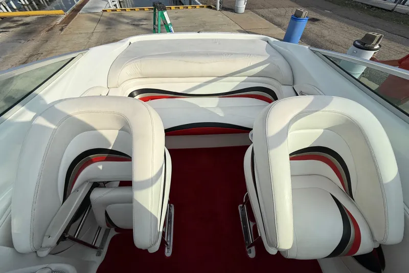 Slide: The Image of 1994 Baja Boss 272 boat interior with white, red, and black seating. - 20