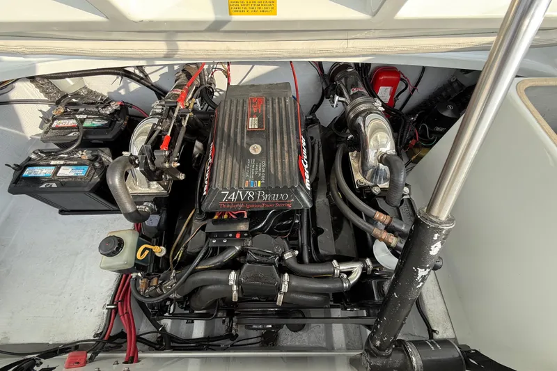 Slide: The Image of Engine compartment of a 1994 Baja Boss 272 boat with V8 engine and dual batteries. - 22