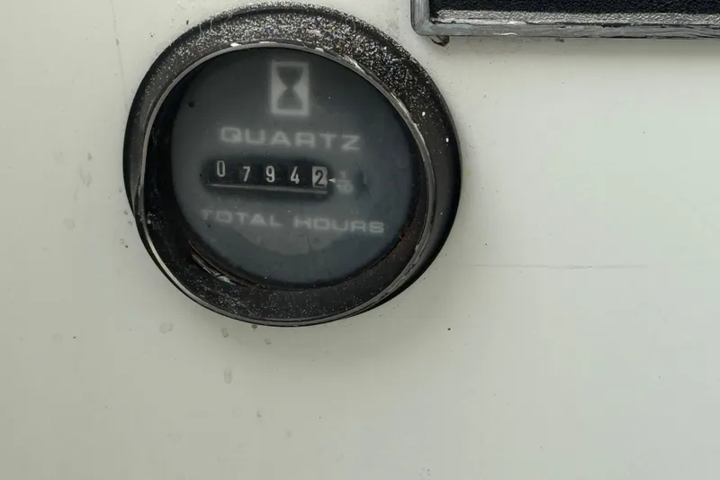 Slide: The Image of Hour meter showing 7942 hours on a 1994 Baja Boss 272 boat. - 23