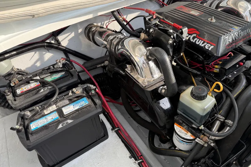 Slide: The Image of Engine compartment of a 1994 Baja Boss 272 boat with dual batteries and MerCruiser engine. - 24