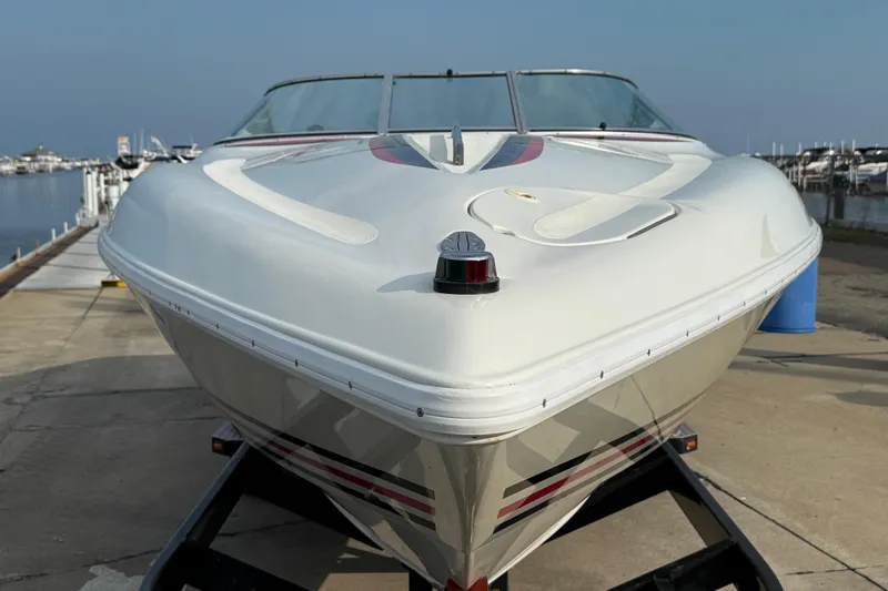 Slide: The Image of 1994 Baja Boss 272 speedboat on trailer at marina dockside. - 7