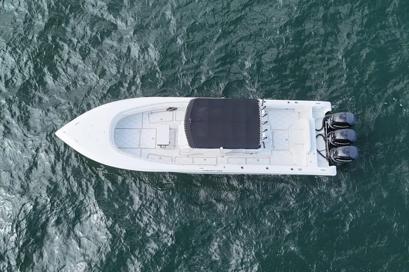 Slide: The Image of Aerial view of 2005 Fountain 34 Sportfish CC Open Bow on water. - 10
