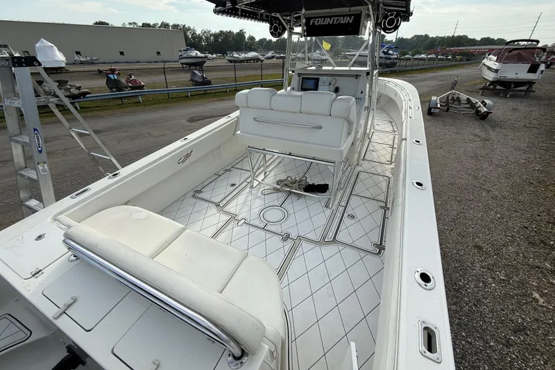 Slide: The Image of 2005 Fountain 34 Sportfish CC Open Bow boat with spacious deck and seating. - 11