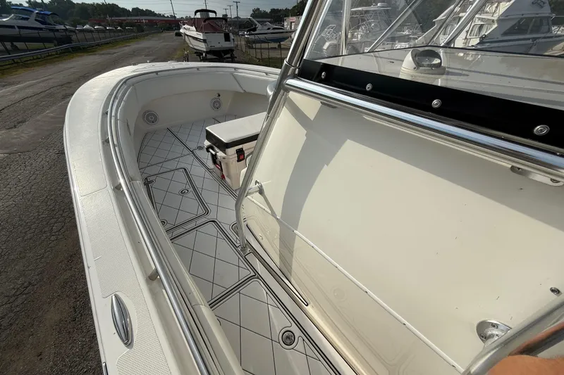 Slide: The Image of 2005 Fountain 34 Sportfish CC Open Bow boat interior with seating and storage. - 20