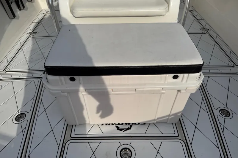 Slide: The Image of 2005 Fountain 34 Sportfish CC Open Bow boat interior with cushioned storage seat. - 22