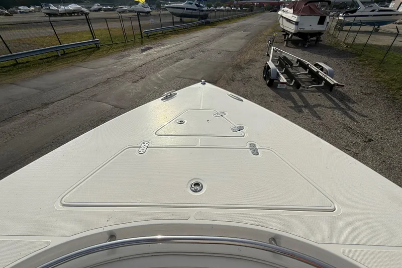 Slide: The Image of 2005 Fountain 34 Sportfish CC Open Bow boat on trailer in marina. - 23