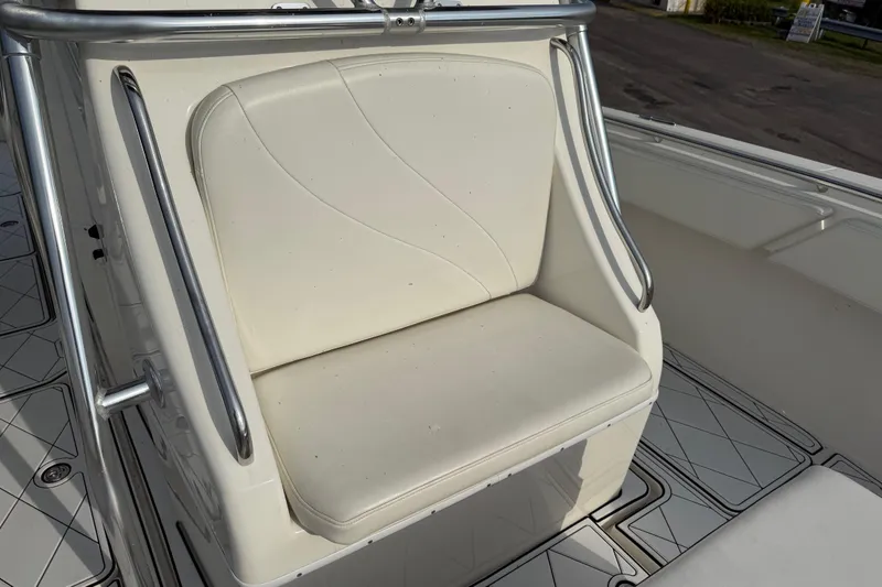 Slide: The Image of 2005 Fountain 34 Sportfish CC Open Bow, white seating area with stainless steel railings. - 25
